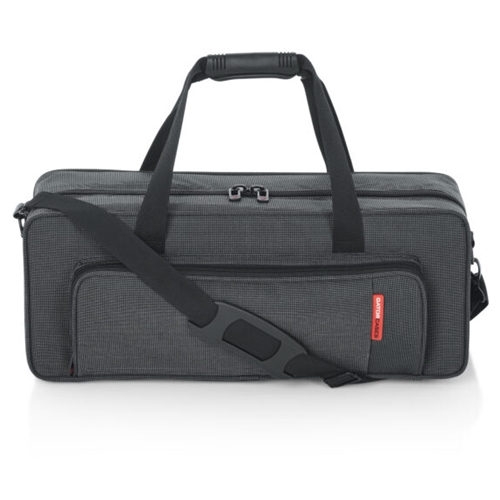 A Lightweight Rigid Nylon Case with a Plush Covered Dense EPS Foam Interior, Interlocking Comfort Grip Handle, Exterior Storage Pocket, Adjustable Removable Shoulder Strap with No-Slip Rubber Pad, Reinforced D-Rings for Attaching and Removing Shoulder Strap and Reinforced Side Carry Handle.