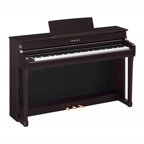 Yamaha Clavinova Rosewood, CLP-835R.

The CLP-835 blends over a century of piano craftsmanship with cutting-edge digital technology. Immerse yourself in the binaurally sampled sounds of legendary concert grands through headphones, or through the built-in stereo speaker system with Virtual Resonance Modeling. With a host of features and Voices, the CLP-835 offers a world-class musical experience.

GRAND EXPERIENCE
Enjoy the extraordinarily realistic touch and feel of a grand piano through the GrandTouch-S keyboard and the GrandTouch pedal. The keyboard's escapement provides a satisfying click when keys are pressed, a sensation unique to grand pianos, while the light-to-heavy weighted keys ensure precise playability.

IMMERSIVE SOUND
Enjoy immersive sound through a revolutionary speaker system with diffuser technology. The Binaural CFX voice with Grand Expression Modeling and Virtual Resonance Modeling (VRM) delivers vivid and richly varied tones, capturing the countless nuances of a concert grand piano.

TIMELESS BEAUTY
The CLP-835 is beautifully crafted with a classic aesthetic while delivering a contemporary user experience. Its space-saving, taller acoustic cabinet design adds elegance to any space, while the easy-to-use LCD display ensures effortless navigation of onboard interface features.

A LEGACY OF EXCELLENCE
The CLP-835 carries the legacy of Yamaha craftsmanship and expertise, delivering the genuine sound and feel of a grand piano. You’ll experience the timeless tone and quality that Yamaha is renowned for, ensuring a realistic and rich playing experience.

SMART PIANIST WITH POWERFUL SHEET MUSIC READER TECHNOLOGY
Enjoy the Clavinova even more with Smart Pianist, an exclusive app from Yamaha. This robust app includes Sheet Music Reader technology, which plays the notes of any "You Are The Artist" sheet music on your smart device. You can also control every feature and setting of your instrument with Smart Pianist, as well as learn to play hundreds of popular songs with its built-in lessons.